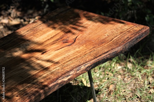 milled wooden slab in the oak shadows
