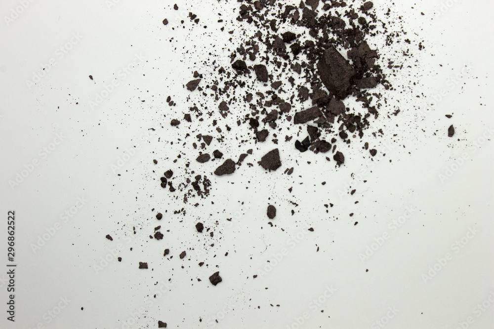 This is a photograph of a Dark Brown powder eyeshadow isolated on a White background This is a photograph of a Dark Brown powder eyeshadow isolated on a White background