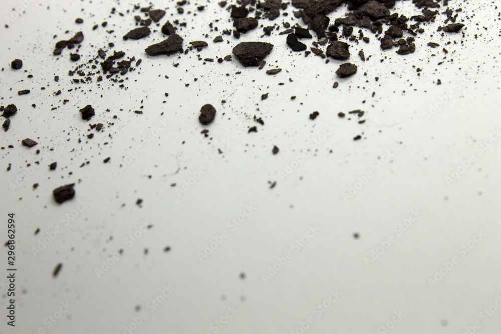 This is a photograph of a Dark Brown powder eyeshadow isolated on a White background This is a photograph of a Dark Brown powder eyeshadow isolated on a White background