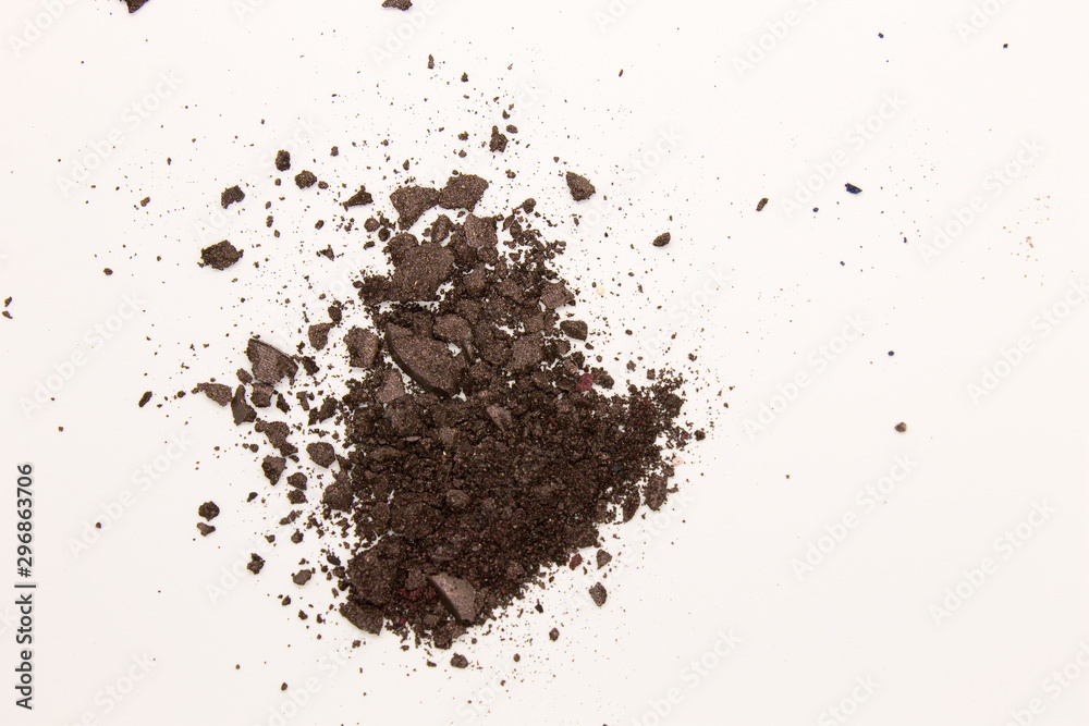 This is a photograph of a dark Brown powder Eyeshadow isolated on a White background This is a photograph of a dark Brown powder Eyeshadow isolated on a White background