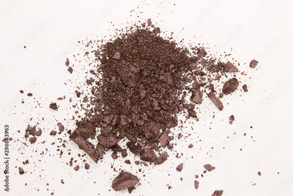 This is a photograph of a Dark Purple powder Eyeshadow isolated on a White background This is a photograph of a Dark Purple powder Eyeshadow isolated on a White background