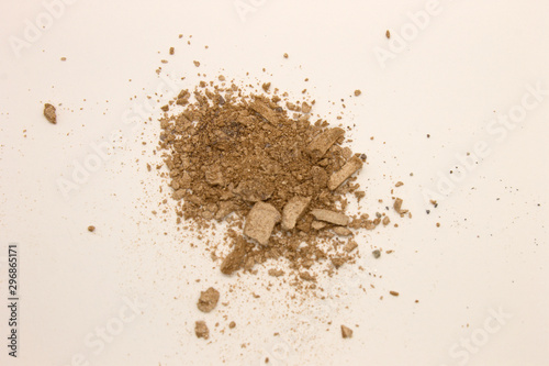 This is a photograph of pale Taupe powder Eyeshadow isolated on a White background