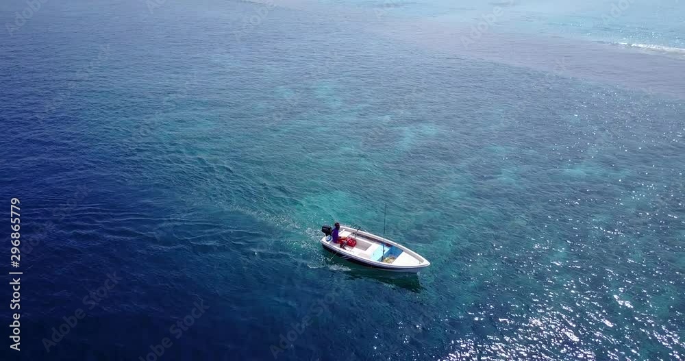Drone circling a boat while it sails near the coast of Malaysia Drone circling a boat while it sails near the coast of Malaysia