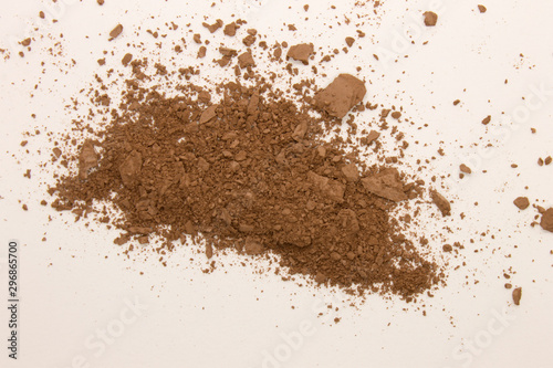 This is a photograph of a Bronzer powder makeup isolated on a White background