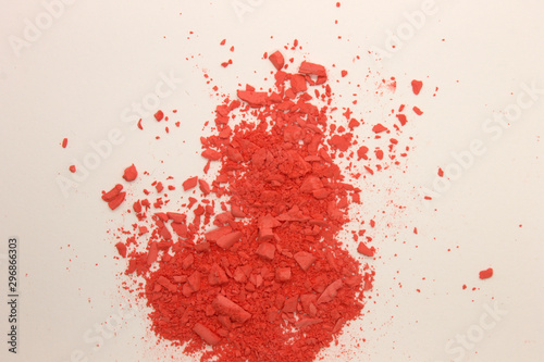 This is a photograph of Orange powder Blusher isolated on a White background