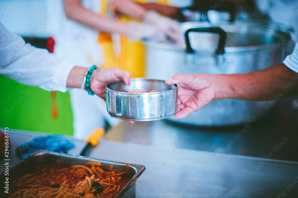 Obraz premium Food donated to hungry people homeless, Free food to beggars : concept of giving