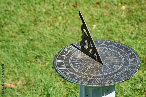 Vintage metal sundial in a park