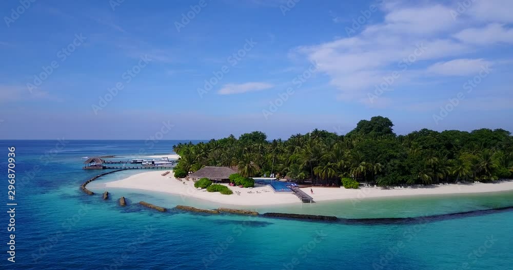 Outstanding travel destination in The Maldives island surrounded by coral reef barriers in the middle of ocean Outstanding travel destination in The Maldives island surrounded by coral reef barriers in the middle of ocean