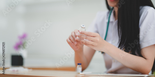 Close-up view of young female doctor explaining medical description
