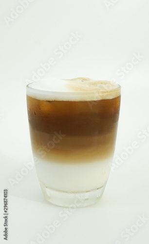 cold coffee with layer of milk and coffee on white background