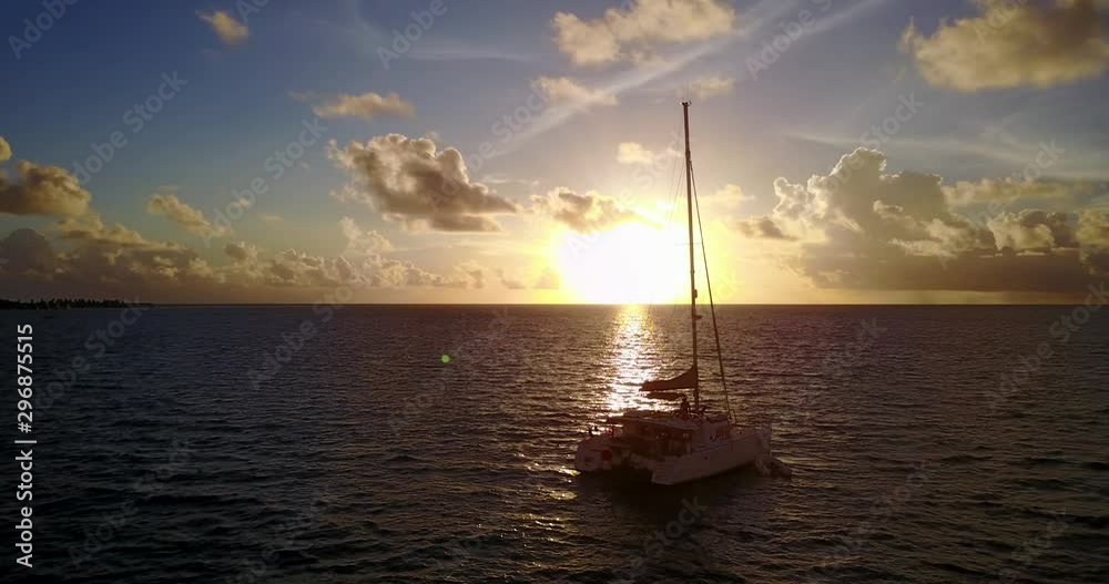 Aerial view of a fabulous scenery at sunset, luxury yacht anchored near shore of Montserrat, Caribbean Aerial view of a fabulous scenery at sunset, luxury yacht anchored near shore of Montserrat, Caribbean