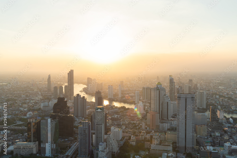 Bangkok cityscape and Chao Phraya river on sunny misty morning