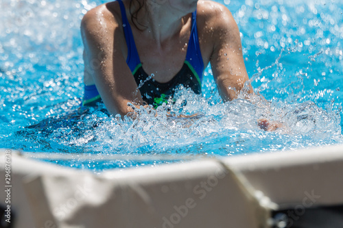 Women Doing Water Aerobics Outdoor in a Swimming Pool