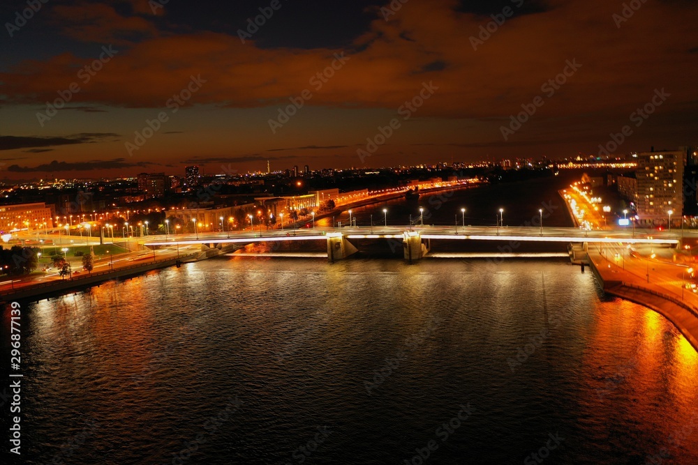 Panorama of the night city.River bridge.Photos from the drone.