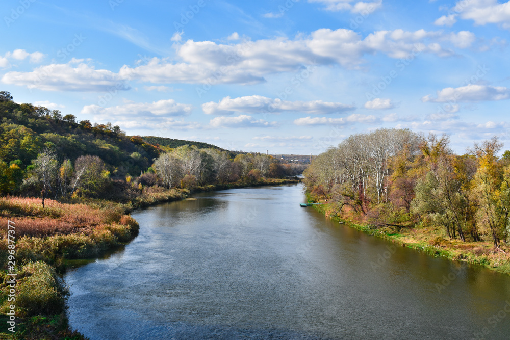 Autumn landscape with a river, trees and beautiful clouds. Autumn landscape with a river, trees and beautiful clouds.