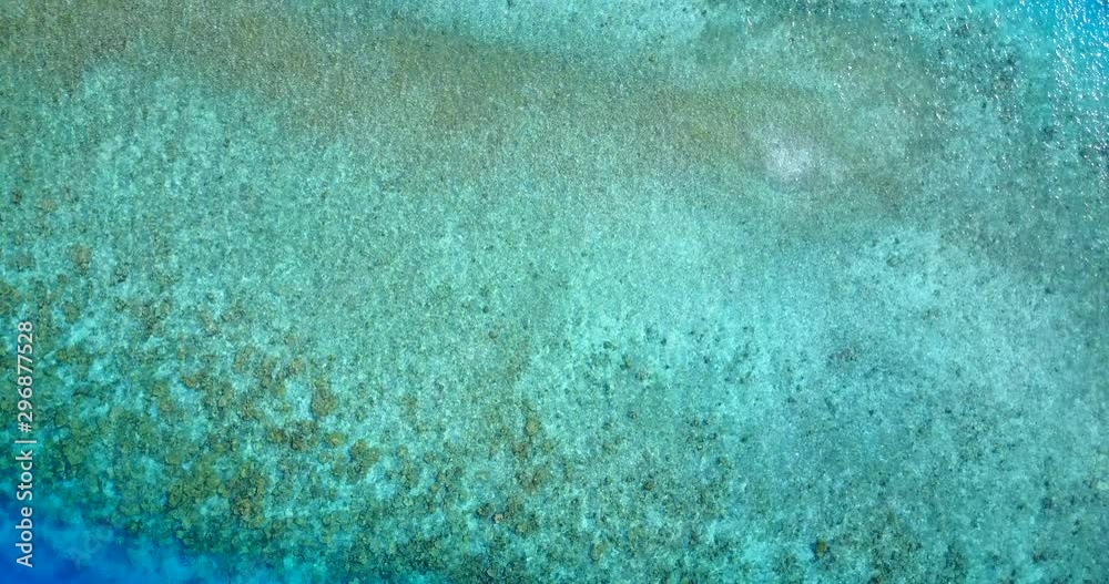 Top view of brighten colorful ocean surface from turquoise to deep blue waters over Bocas del Toro Archipelago Top view of brighten colorful ocean surface from turquoise to deep blue waters over Bocas del Toro Archipelago