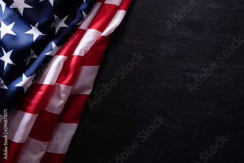 Happy Veterans Day. American flags veterans against a blackboard background. photo