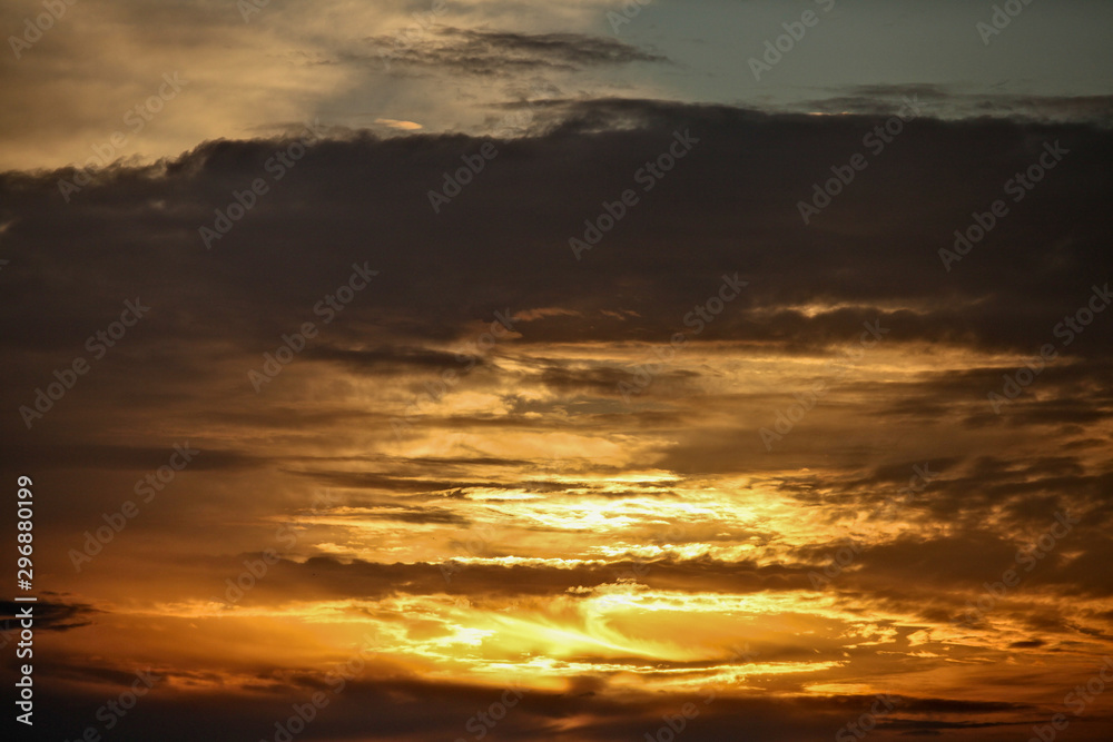 Diffuse sunset thru cloudy sky