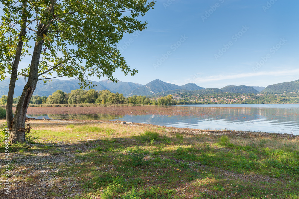 Beautiful Italian lake. Lake of Pusiano (moiana area) with the town of Penzano - Eupilio in the background. Lake of glacial origin