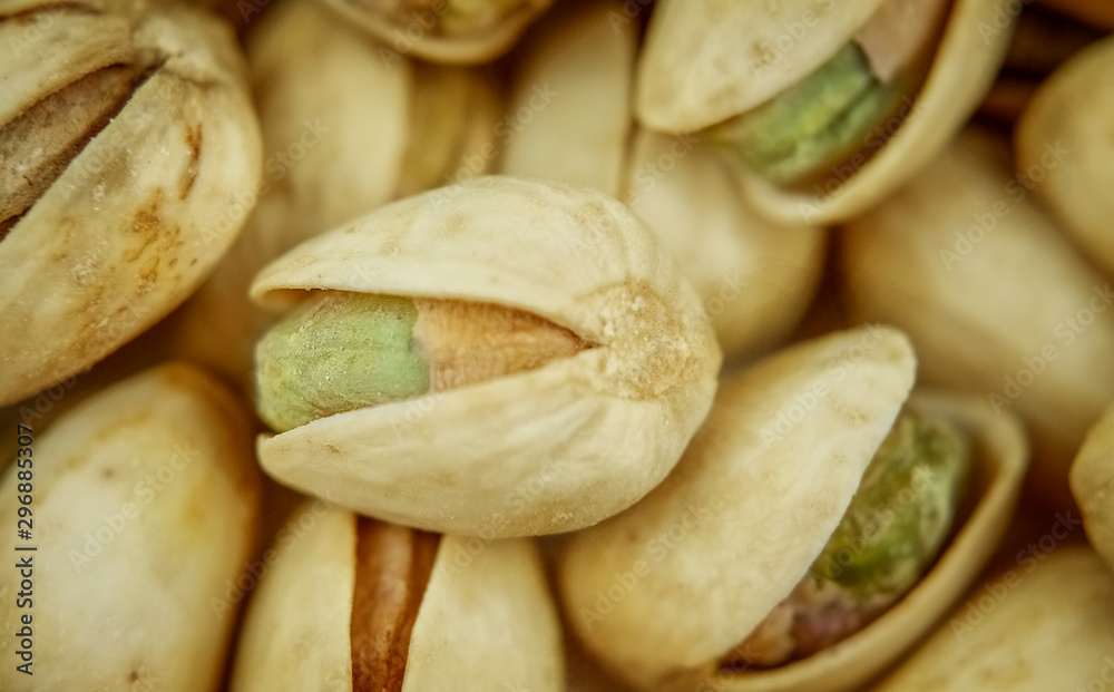 Salty pistachios. Selective focus. Tasty nuts. Popular snack. Salty pistachios. Selective focus. Tasty nuts. Popular snack.