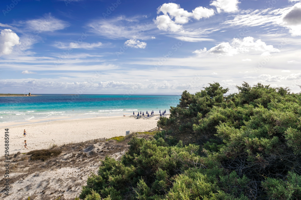 Stintino, La Pelosa beach, is one of the most beautiful sandy beaches of the Mediterranean. Turquoise water. Sassari, Sardinia, Italy. Stintino, La Pelosa beach, is one of the most beautiful sandy beaches of the Mediterranean. Turquoise water. Sassari, Sardinia, Italy.