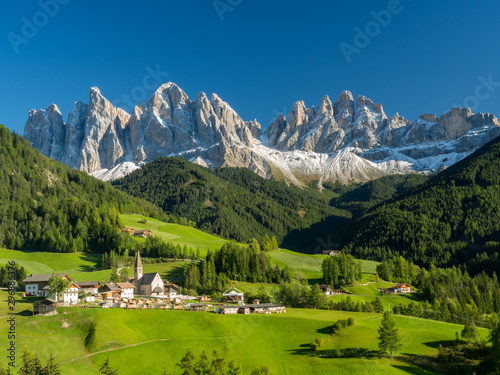 Italy, september 2017: St. Magdalena with its characteristic church in front of the Geisler Dolomites mountain peaks in the Villnosstal in autumn.