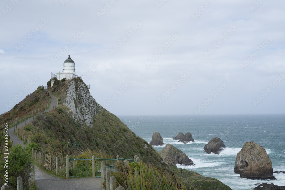 Nugget Point Light House in sunny day.Beautiful view toward Nugget Point in New Zealand.