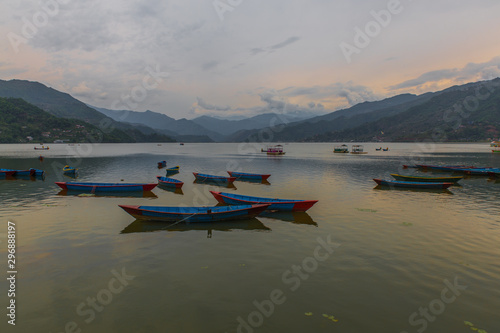 colorful boats in Fewa lake after the storm in Pokhara, Nepal