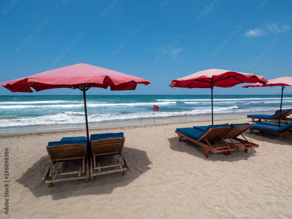 KUTA BALI - INDONESIA, November 2018 : Colourful sun umbrellas on the famous beach on Kuta in Bali