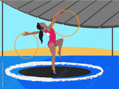 Young girl doing gymnastics with hoops