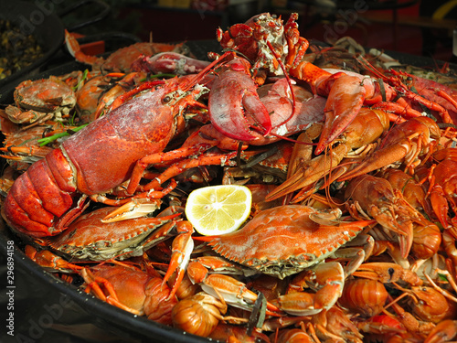 Seafood Crabs, lobster, shellfish, shrimps with lemon on grill