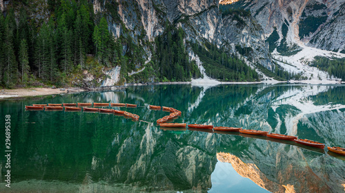 Wooden boats on Lago di Braies in Dolomites, Italy