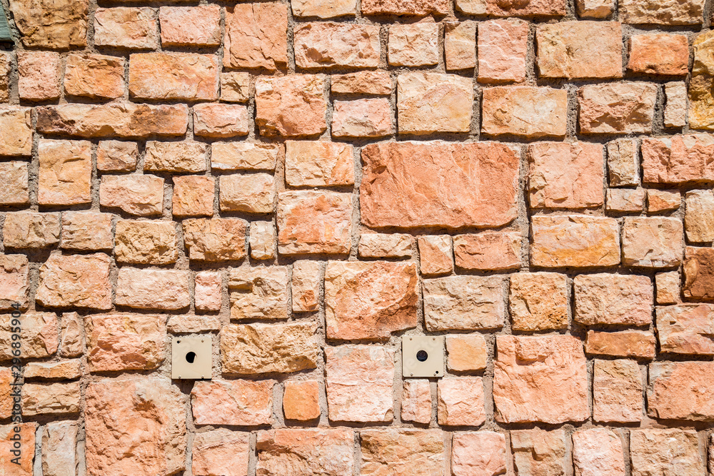 Fototapeta premium Textured wall of a building that could be used as a background for your purposes