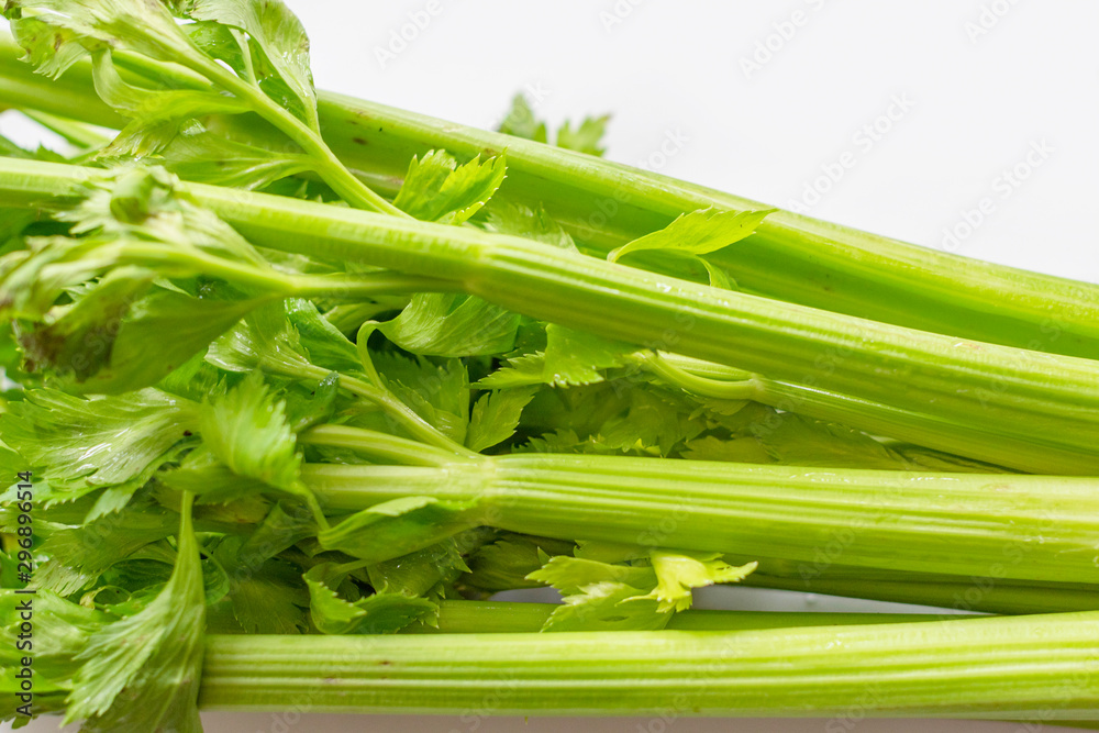 celery stalks on white background. fresh green celery. celery stalks on white background. fresh green celery.
