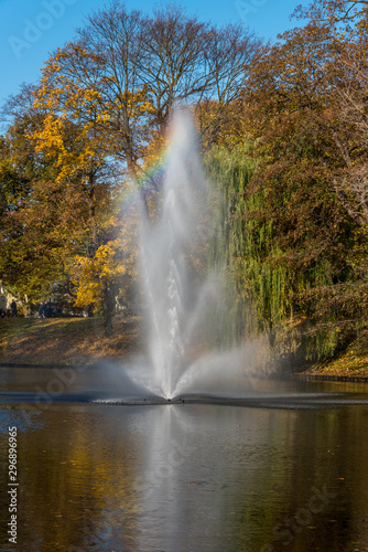 Rainbow in a Fountain's Spray on a Sunny Day in Autumn