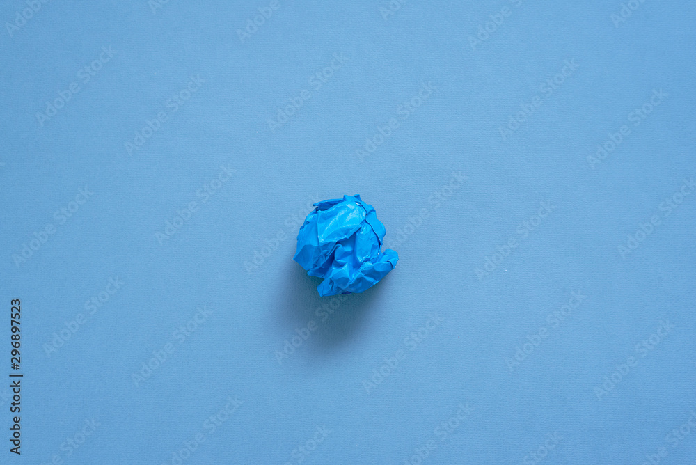 Crumpled colorful paper pages on blue background. Crumpled colorful paper pages on blue background.