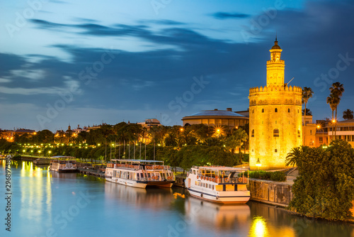 The Golden Tower (Torre del Oro) in Seville, Spain, is located at the margin of the Guadalquivir river and was built in the XIII century by the muslims ruling the area at the time. photo