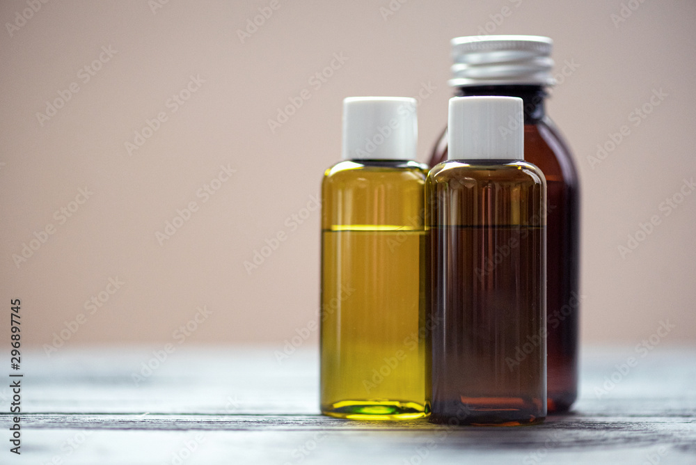 Aromatherapy oil in a bottles on the table. Aromatherapy oil in a bottles on the table.