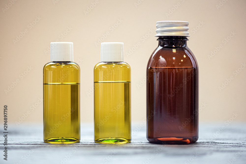 Aromatherapy oil in a bottles on the table. Aromatherapy oil in a bottles on the table.