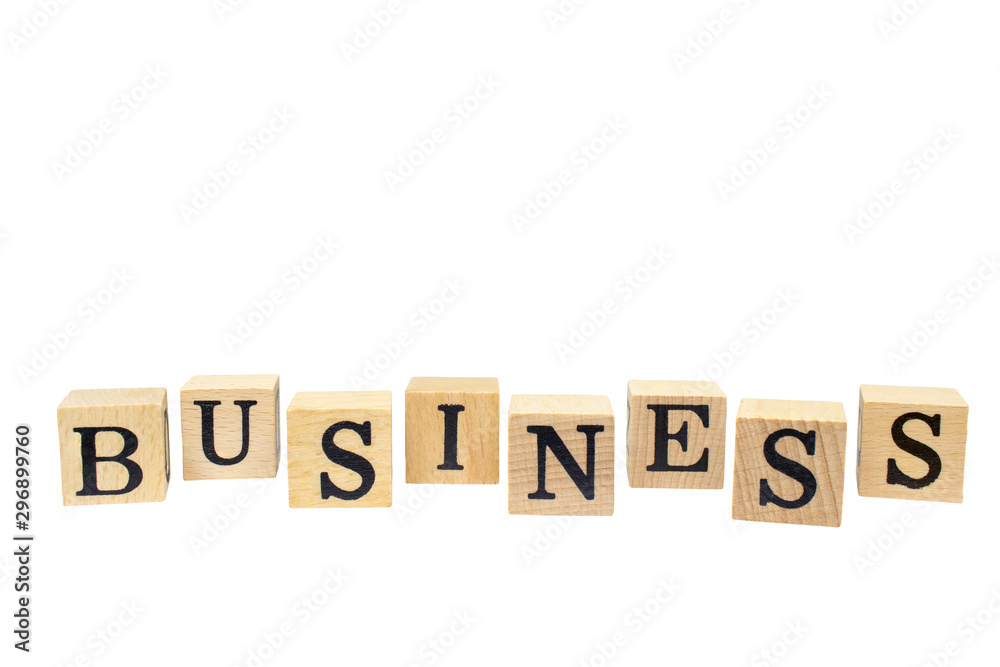 BUSINESS words on wooden block isolated on white background. BUSINESS words on wooden block isolated on white background.