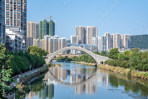 High-rise buildings on the banks of the Lancang River in Zhangzhou City, Hunan Province, China photo