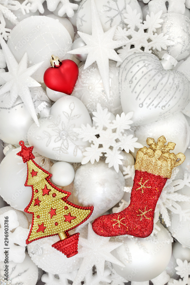 Christmas tree white red & gold bauble decorations forming an abstract background. Traditional festive symbols for the holiday season. Christmas tree white red & gold bauble decorations forming an abstract background. Traditional festive symbols for the holiday season.
