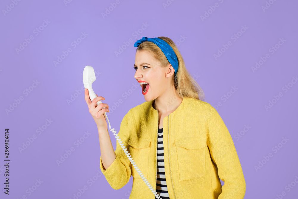 Shouting girl in telephone handset. Human emotion and feeling. Angry pinup girl screaming in handset. Screaming woman with handset of stationary phone. Emotional girl. Shouting woman talking by phone. Shouting girl in telephone handset. Human emotion and feeling. Angry pinup girl screaming in handset. Screaming woman with handset of stationary phone. Emotional girl. Shouting woman talking by phone.
