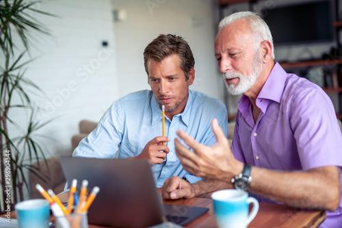 Two businessmen working together