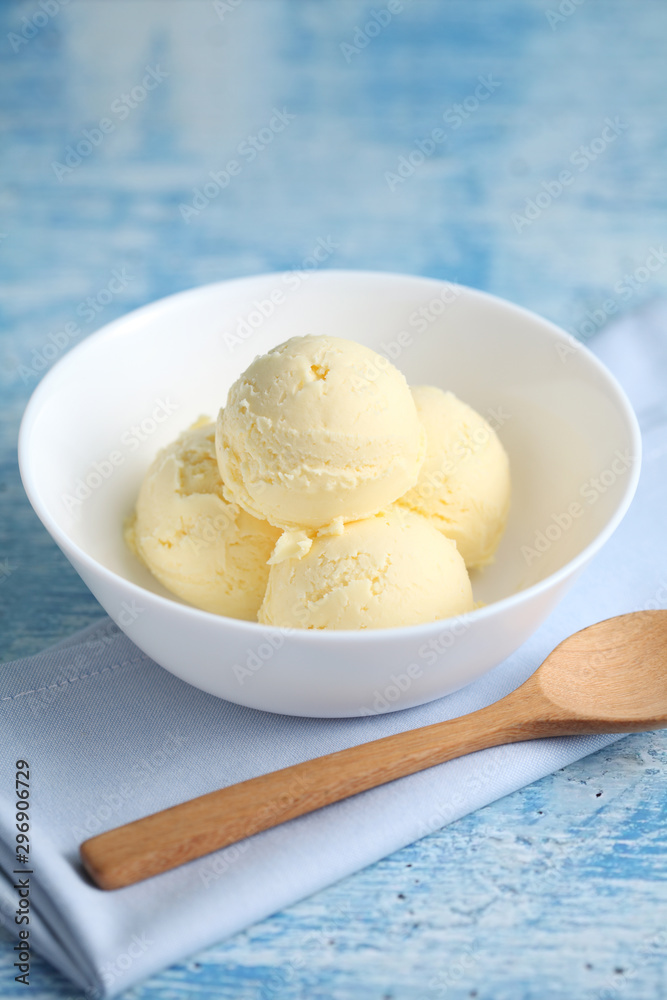 vanilla ice cream on a blue background with a blank space for a text, vanilla ice cream in white ceramic cup vanilla ice cream on a blue background with a blank space for a text, vanilla ice cream in white ceramic cup