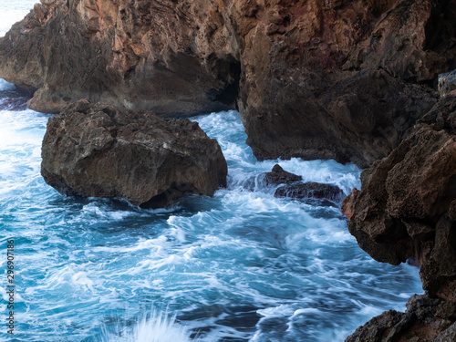 Rocky beach with caves and turquoise sea