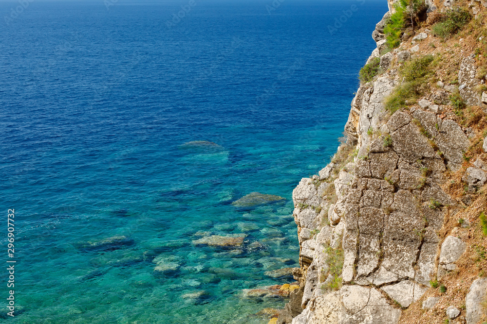 Mediterranean sea rocky shore with turquoise water