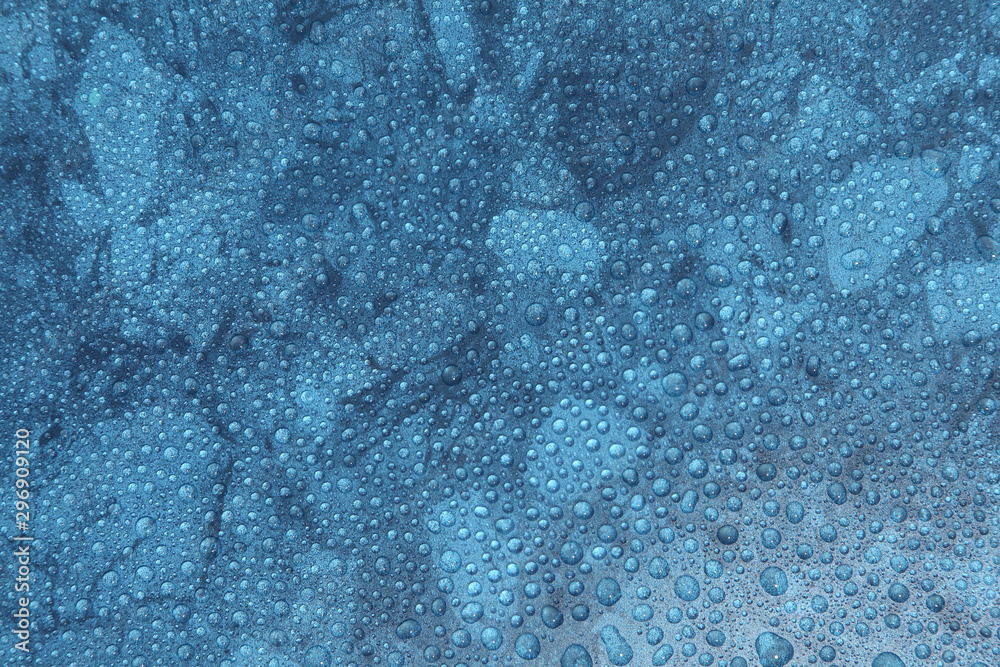 Obraz premium Close up water drops on blue background, Water drop in macro photography