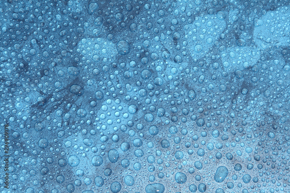 Fototapeta premium Close up water drops on blue background, Water drop in macro photography