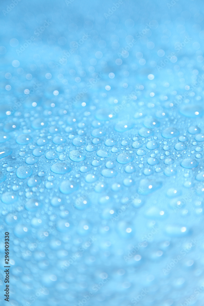 Close up water drops on blue background, Water drop in macro photography